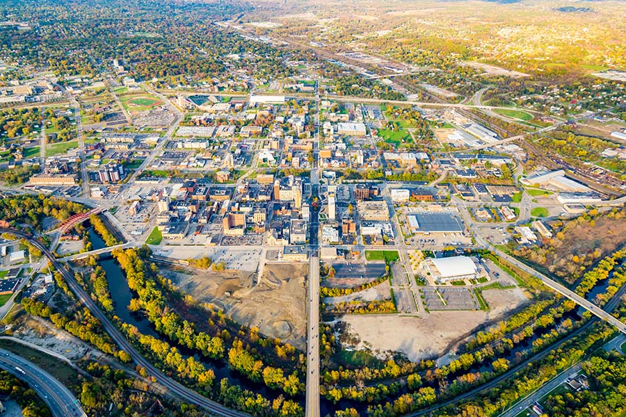 Canfield OH - Aerial View of the City of Youngstown Ohio and Surrounding Suburbs with Green Foliage on Sunny Day